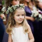 side-braid-flower-girl-hairstyle-with-flower-hoops